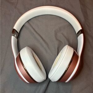 Rose gold Beats headphones